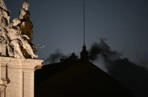 Black smoke rises from the chimney of the Sistine Chapel